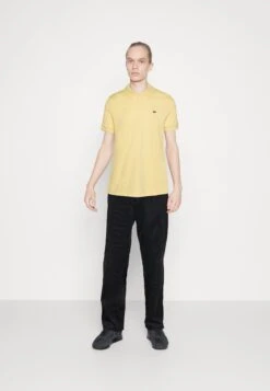 Lacoste Unisex - Polo - Yellow -Mode et Luxe Boutique 0dfb8640ebb6465b824c3be5cc50b47e