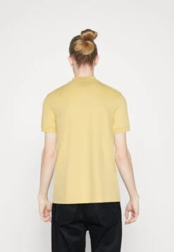 Lacoste Unisex - Polo - Yellow -Mode et Luxe Boutique 22c8d0b8b73a4b83bb1451e1509646bc