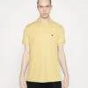 Lacoste Unisex - Polo - Yellow -Mode et Luxe Boutique 650ecd8ec3d94719b1e90f242447ff96